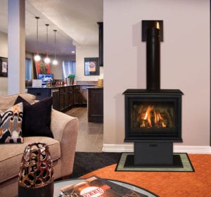 A small, rectangular gas stove is lit up on a side wall of a small living room.