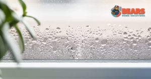 Water droplets on the inside of a window in a home