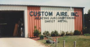 A vintage photo of an old Custom Aire office.