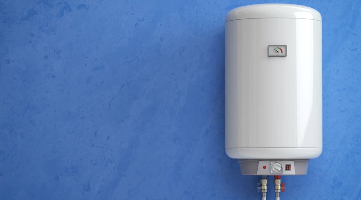 A modern tankless water heater hanging on a plain blue wall