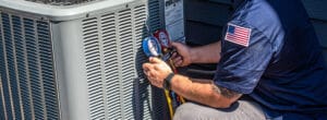 A Bears Home Solutions worker maintaining an air conditioning unit