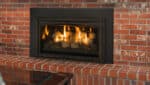 A Chaska Kozy Heat fireplace insert with a brick surround