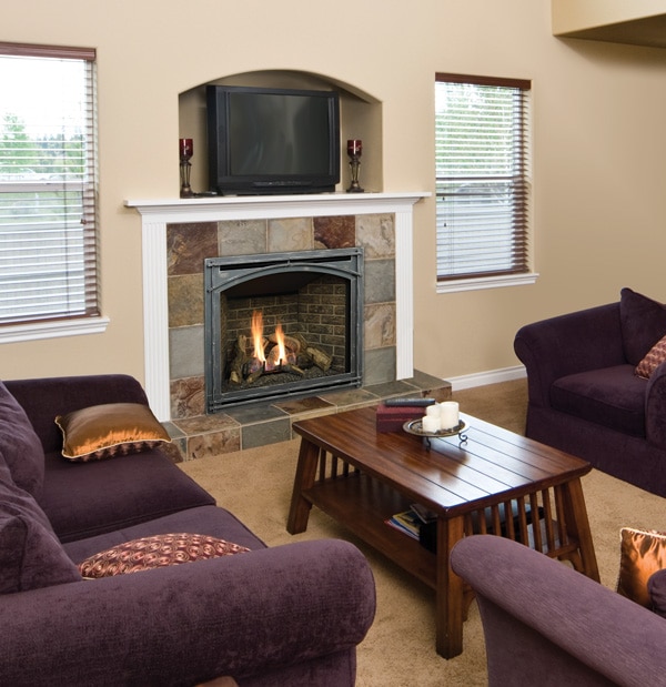 Gas fireplace lit in a family room.