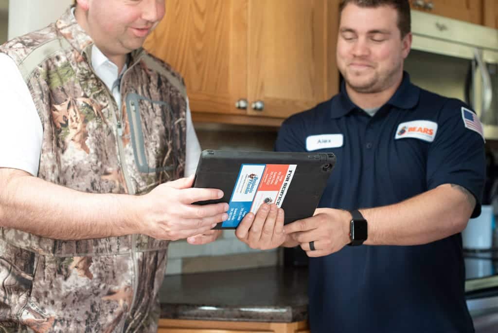 Bears Home Solutions service technician consulting with a customer