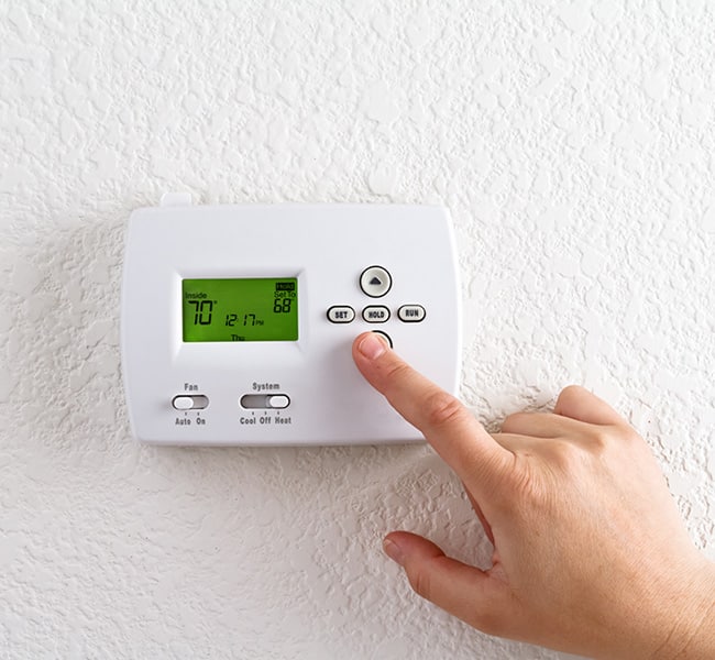 hand adjusting thermostat